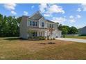 Two-story home with two-car garage and landscaped yard at 91 Walker Grove Ln, Lillington, NC 27546