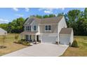 Two-story home with two-car garage and large yard at 91 Walker Grove Ln, Lillington, NC 27546