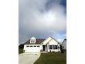 Newly built two-story home with white siding and a two-car garage at 72 Scotties Ridge Dr, Princeton, NC 27569