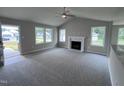 Spacious living room featuring a fireplace and high ceilings at 158 Scotties Ridge Dr, Princeton, NC 27569