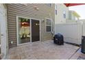 Backyard patio with sliding glass door access and grill at 6425 Swatner Dr, Raleigh, NC 27612