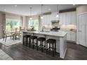 Spacious kitchen with white cabinets, granite countertops, and a large island at 508 Impala Trce, Wendell, NC 27591