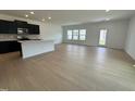 Open concept kitchen with island and dark cabinets at 3125 Ranger Dr # 42, Durham, NC 27703