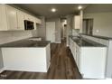 Modern kitchen with granite countertops and white cabinets at 86 Scotties Ridge Dr, Princeton, NC 27569