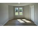 Bright bedroom with two large windows and neutral wall colors at 144 Scotties Ridge Dr, Princeton, NC 27569