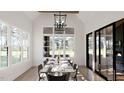Bright dining room with a large table and access to a patio at 3709 Joyful Creek Trl, Zebulon, NC 27597
