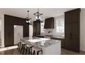 Modern kitchen with dark cabinetry and marble countertops at 3709 Joyful Creek Trl, Zebulon, NC 27597