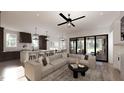 Open concept living room with a comfortable sectional sofa at 3709 Joyful Creek Trl, Zebulon, NC 27597