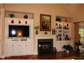 Spacious living room with a fireplace and built-in shelving at 3331 Lazy Ln, Graham, NC 27253