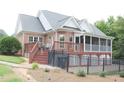 Home features a large deck, screened porch, and fenced backyard at 3331 Lazy Ln, Graham, NC 27253