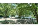 Relaxing riverfront view with Adirondack chairs at 1500 River Mill Drive Dr # 110, Wake Forest, NC 27587