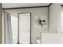 Bathroom with shower/tub combo and neutral color palette at 369 Sombrero Ln, Henderson, NC 27537