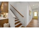 Modern staircase with light wood treads and white risers at 226 Beacon Dr, Pittsboro, NC 27312