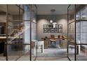 Bright home office features a glass partition and modern desk at 5428 Winding View Ln, Raleigh, NC 27615