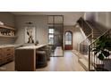 Elegant staircase with modern metal railing and wood steps at 5428 Winding View Ln, Raleigh, NC 27615