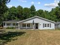 Ranch-style home with front porch and lawn at 3716 Pearl Rd, Raleigh, NC 27610