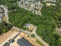 Aerial view showing house surrounded by trees at 3716 Pearl Rd, Raleigh, NC 27610