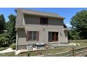House exterior showcasing stone foundation, patio, and rear view at 901 Tanglewood Dr, Siler City, NC 27344