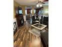 Spacious living room with dark wood floors and fireplace at 506 Averasboro Dr, Clayton, NC 27520