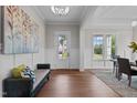 Elegant foyer with hardwood floors and a sitting bench at 816 Willow Tower Ct # 154, Rolesville, NC 27571