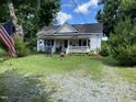 Charming farmhouse with front porch at 7622 Lindley Mill Rd, Graham, NC 27253