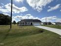 House exterior with two-car garage and front yard at 31 Grace Ridge Ct, Benson, NC 27504