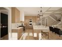 Modern kitchen with light wood cabinets and marble island at 5628 Bella Terra Ct, Wake Forest, NC 27587