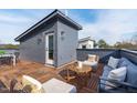 Private rooftop deck with seating area and city views at 614 Rocky Knob Ct, Raleigh, NC 27601