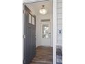 Bright entryway with hardwood floors, white door, and gray door at 8820 Melvin St # 16, Willow Springs, NC 27592