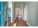 Bright and airy entryway with hardwood floors and soft green walls at Lot 4 Harding St, Efland, NC 27243