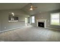 Living room with a fireplace and high ceilings at 46 Scotties Ridge Dr, Princeton, NC 27569