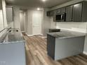 Modern kitchen with gray cabinets and granite countertops at 46 Scotties Ridge Dr, Princeton, NC 27569