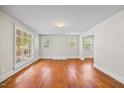 Hardwood floor living room with ample natural light at 1613 Old Wilson Rd, Rocky Mount, NC 27801