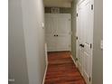 Bright hallway with hardwood floors and access to other rooms at 513 N Carr St, Mebane, NC 27302