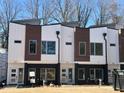 Three contemporary townhouses, showcasing a stylish exterior at 1535 Urban Trace Ln, Raleigh, NC 27608