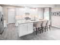 Modern kitchen with white cabinets, granite countertops and island at 8813 Tartan Clan Dr, Willow Springs, NC 27592