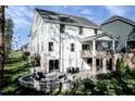 Spacious backyard patio with seating area and fire pit at 8813 Tartan Clan Dr, Willow Springs, NC 27592