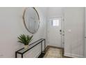 Bright entryway with a large mirror, console table, and rug at 2238 Cherry Top Dr, Fuquay Varina, NC 27526