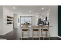 Modern kitchen with island and breakfast bar at 722 Dorset Stream Dr, Fuquay Varina, NC 27526