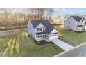 Aerial view of two-story home with driveway and landscaping at 110 Merrifield Ln, Garner, NC 27529