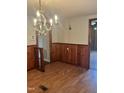 Dining room with wood wall paneling and chandelier at 3226 Bunnlevel Erwin Rd, Erwin, NC 28339