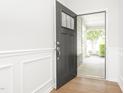 Open door revealing hardwood floor and view to front porch at 258 Tyree Trl, Burlington, NC 27215