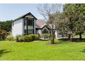 White two-story house with stone accents and lush lawn at 2517 Oakes Plantation Dr, Raleigh, NC 27610
