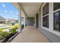 Covered front porch with white columns and views of neighborhood at 135 Glenfield Ln, Burlington, NC 27215
