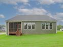 Rear exterior with screened porch and deck at 16 Autumn Breeze Ct, Angier, NC 27501