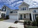 Two story home with gray siding and teal front door at 1220 Porters Call Dr, Wendell, NC 27591
