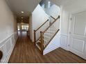 Bright entryway with hardwood floors and staircase at 1220 Porters Call Dr, Wendell, NC 27591