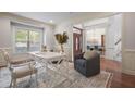 Bright home office with hardwood floors and built-in shelving at 401 S Bend Dr, Durham, NC 27713