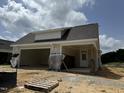 Newly constructed home with attached garage and covered porch at 353 Village Walk Dr, Clayton, NC 27527