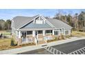 Community clubhouse with brick accents and welcoming porch at 353 Village Walk Dr, Clayton, NC 27527